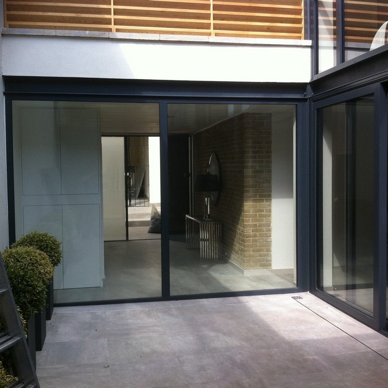 Floor-to-ceiling sliding doors opening to courtyard in Oxford
